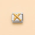 A two-tone Italian charm link featuring a polished gold airplane motif set against a silver-toned rectangular background, centered on a solid pale peach-beige backdrop.