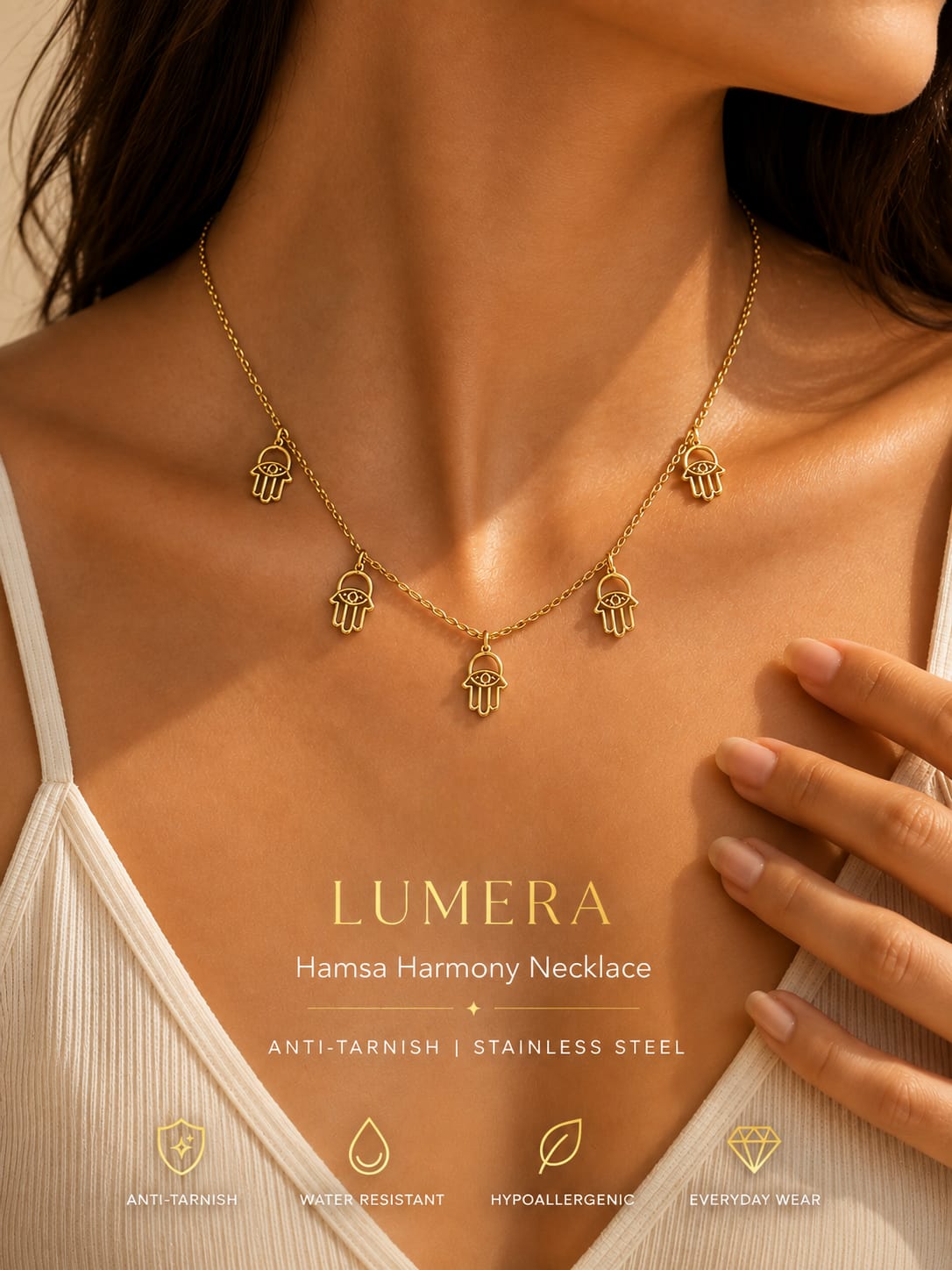 A close-up of a woman wearing a gold Hamsa harmony necklace with five hanging Hamsa charms. The image features warm lighting, a white ribbed tank top, and text overlays reading 'LUMERA Hamsa Harmony Necklace' along with feature icons at the bottom.