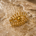 Guardian Eye Ring

Make a bold statement with the Guardian Eye Ring. Featuring a striking eye motif with radiant sunburst detailing, this stainless steel ring blends modern elegance with symbolic charm. Designed with an adjustable fit and a durable gold finish, it's the perfect accessory to elevate any outfit while adding a touch of mystical sophistication.