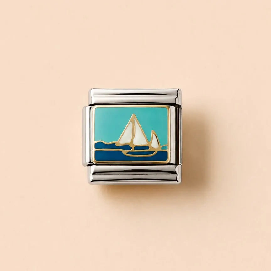 A square silver-toned charm link featuring an enamel sailboat design with a turquoise sky, white sails, and dark blue water, set against a solid pale peach background.