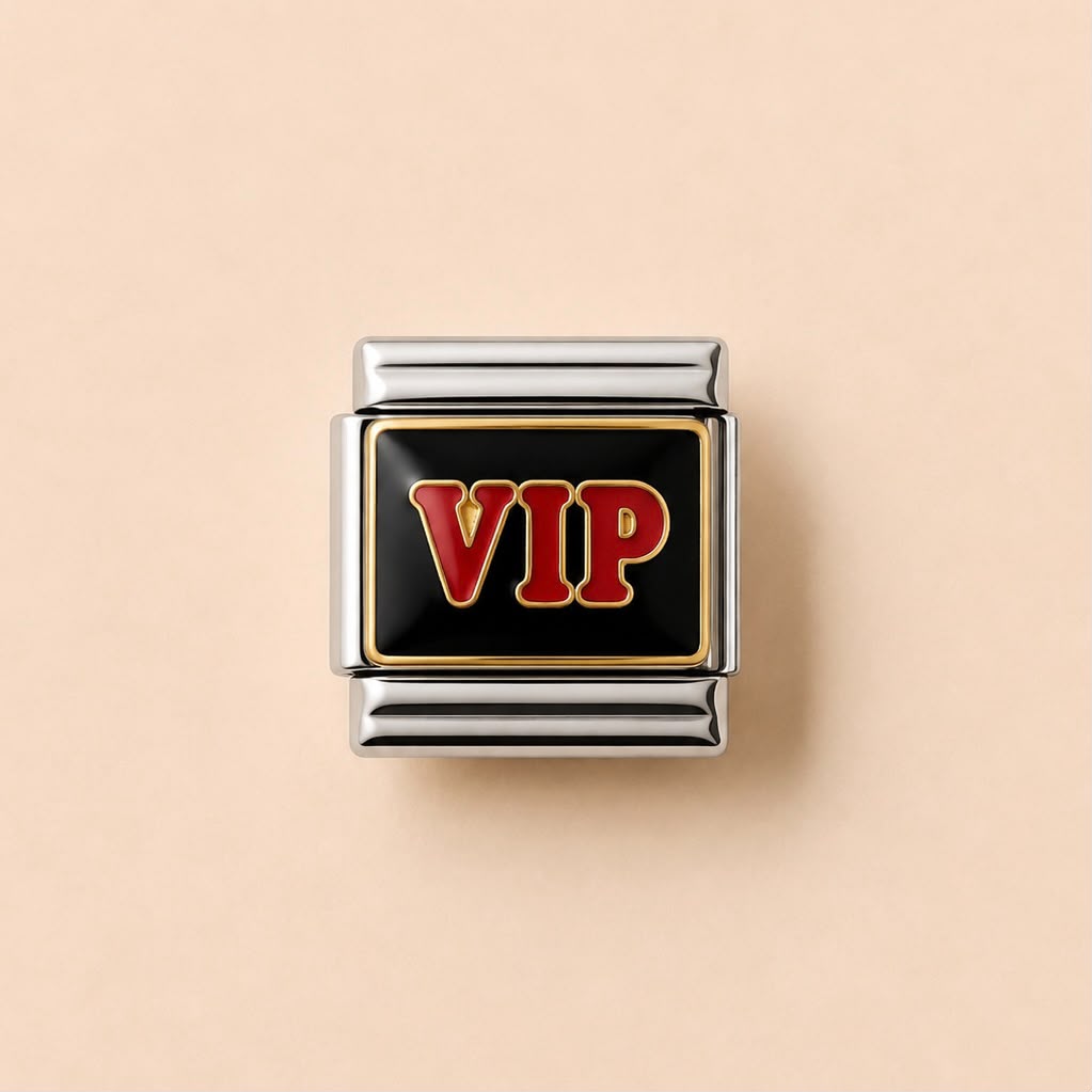 A square charm link featuring a black enamel center with the letters 'VIP' in red and gold, surrounded by a polished silver-tone metal border, set against a solid pale peach background.