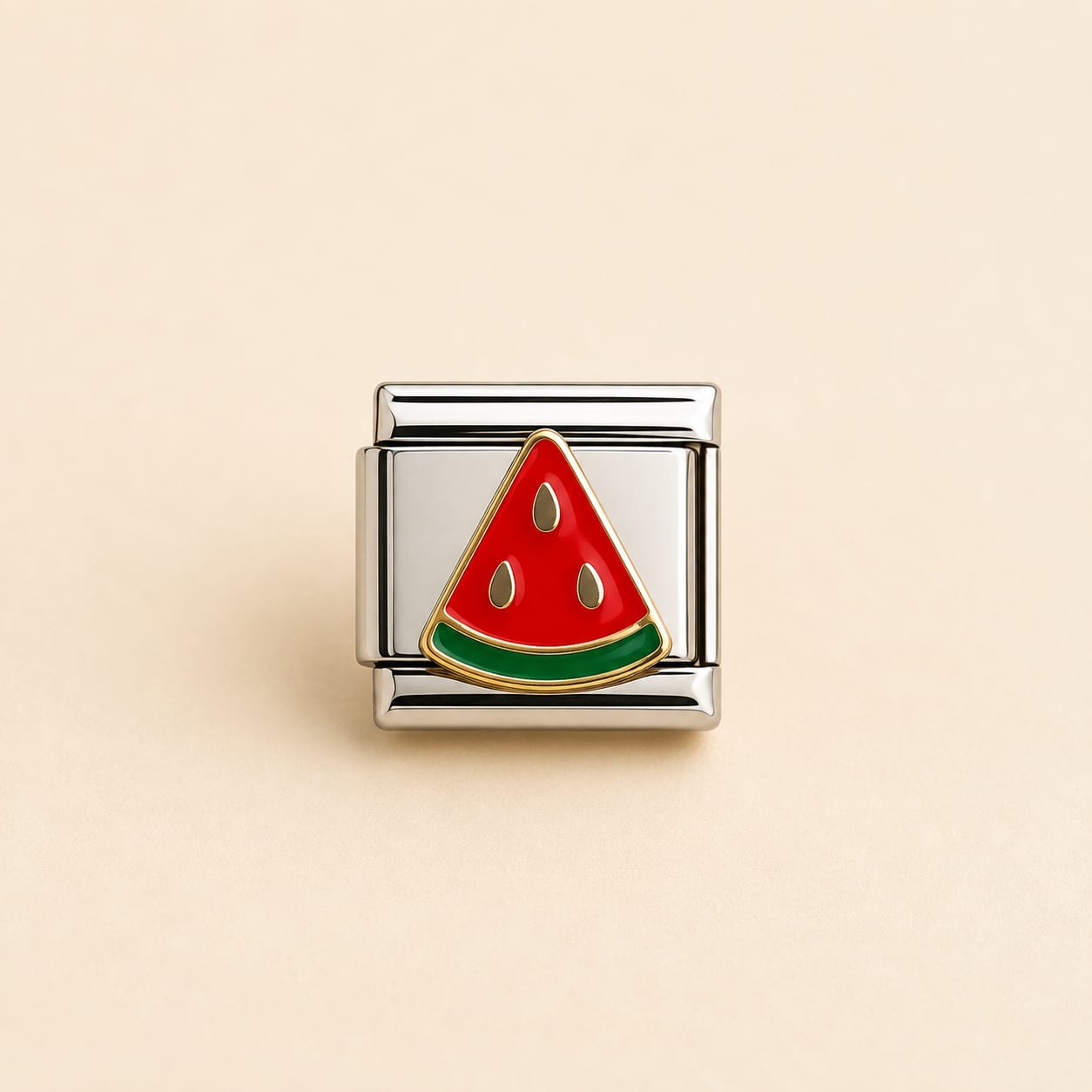 A square Italian charm link featuring a watermelon slice design with red and green enamel, set in polished silver-tone metal, centered on a light beige background.